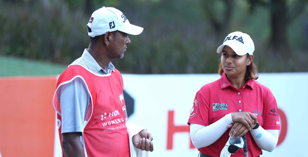 Sachin (caddie) & Hitaashee Bakshi during the round today at DLF Golf & CC in Gurgaon